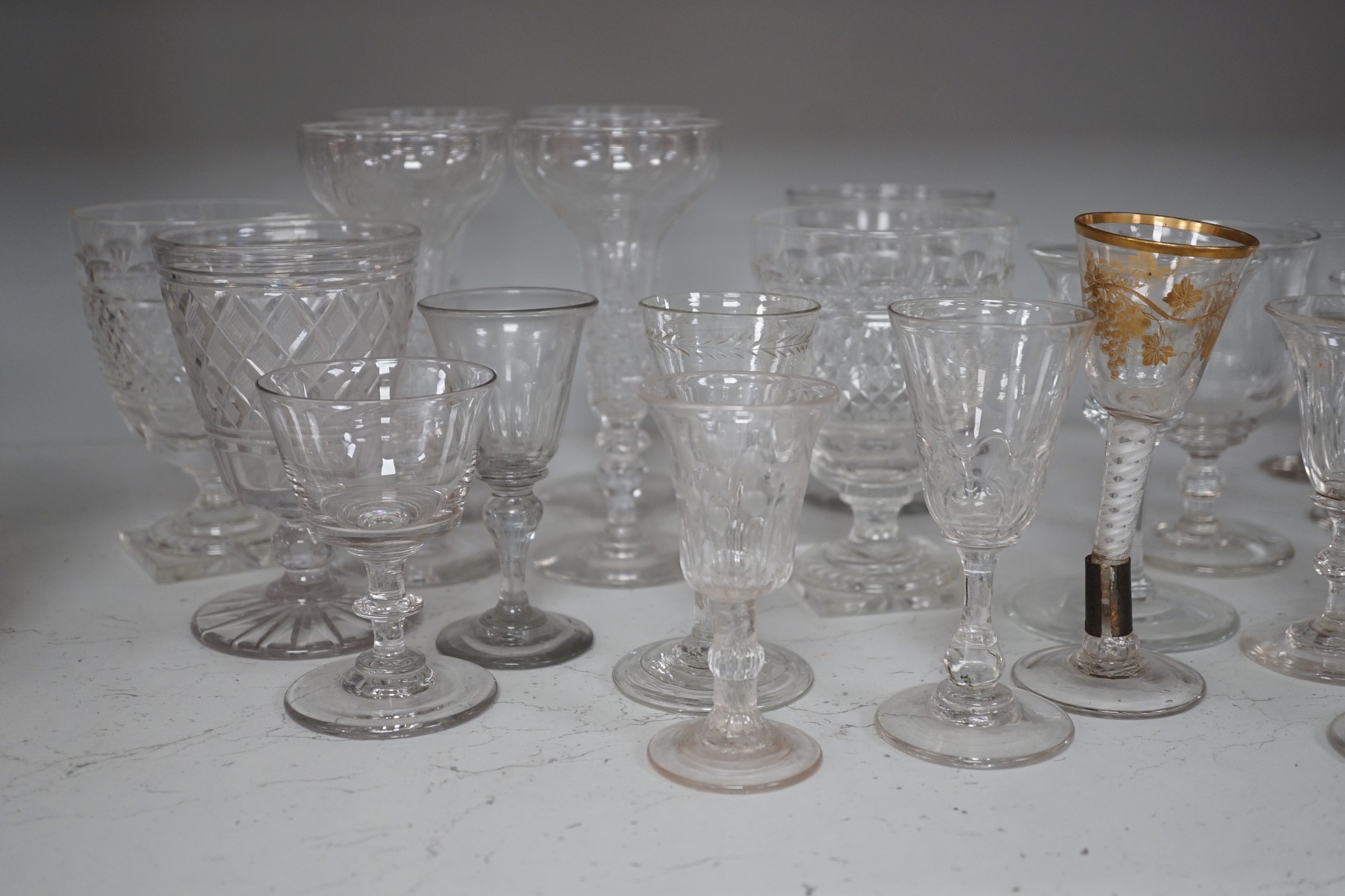 A quantity of assorted 18th / 19th century and later clear drinking glasses including a damaged James Giles gilt decorated opaque twist stem wine glass.